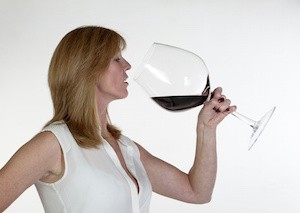 Woman with a very large glass of red wine